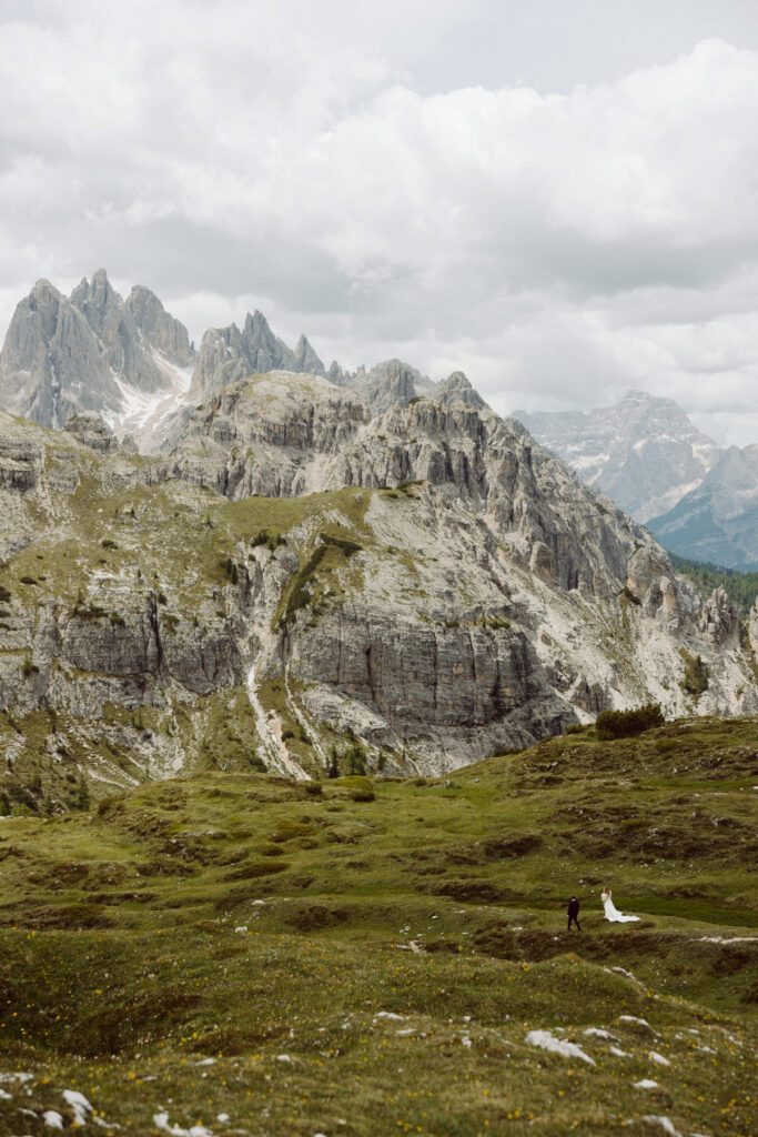 Couple at the iconic Cadini di Misurina viewpoint during a sunrise Dolomites elopement.