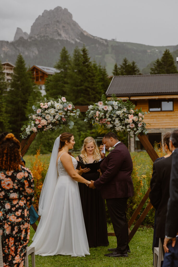 Intimate family ceremony during a destination wedding in the Dolomites, Italy.